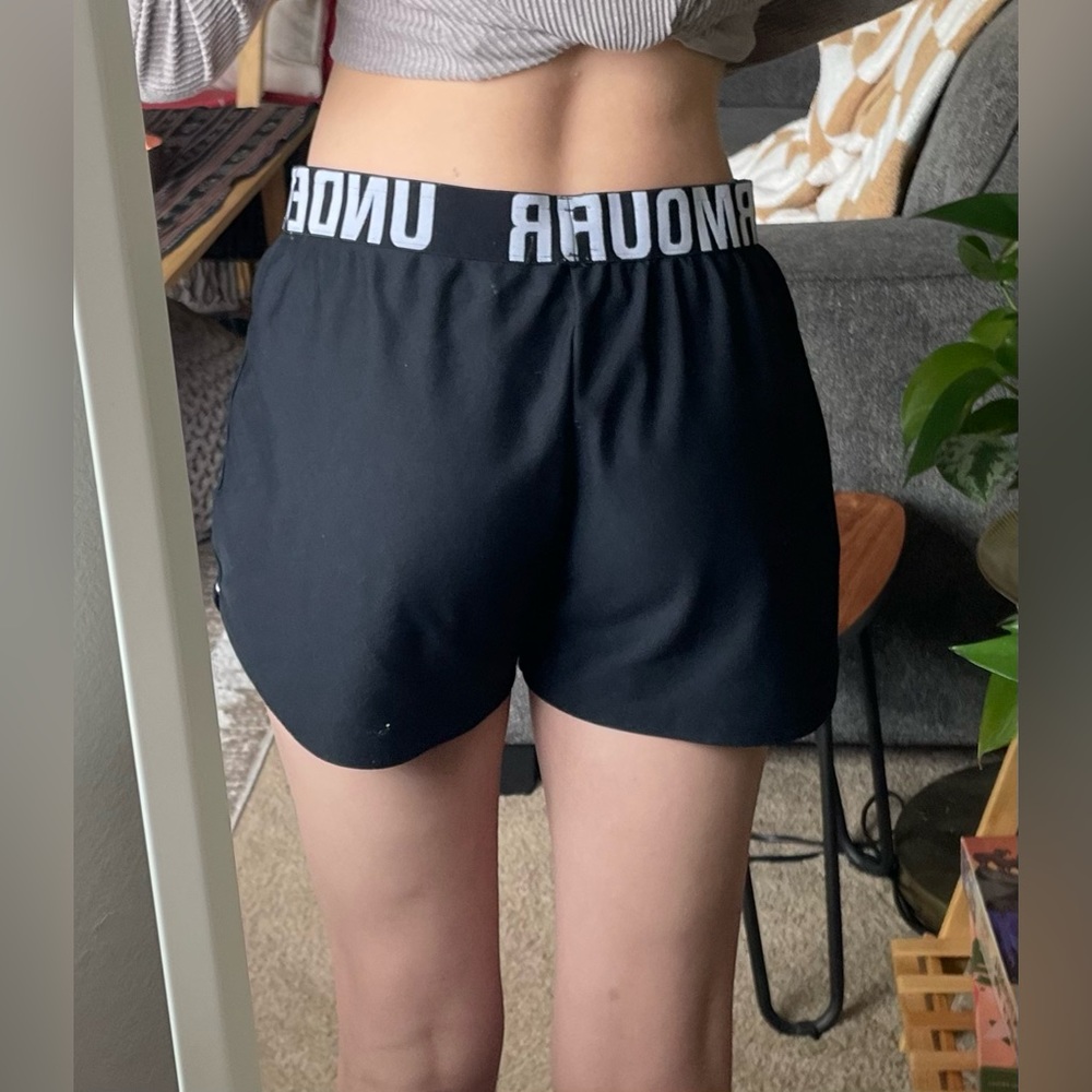 True black, breathable shorts with white details and logo around the waistband.